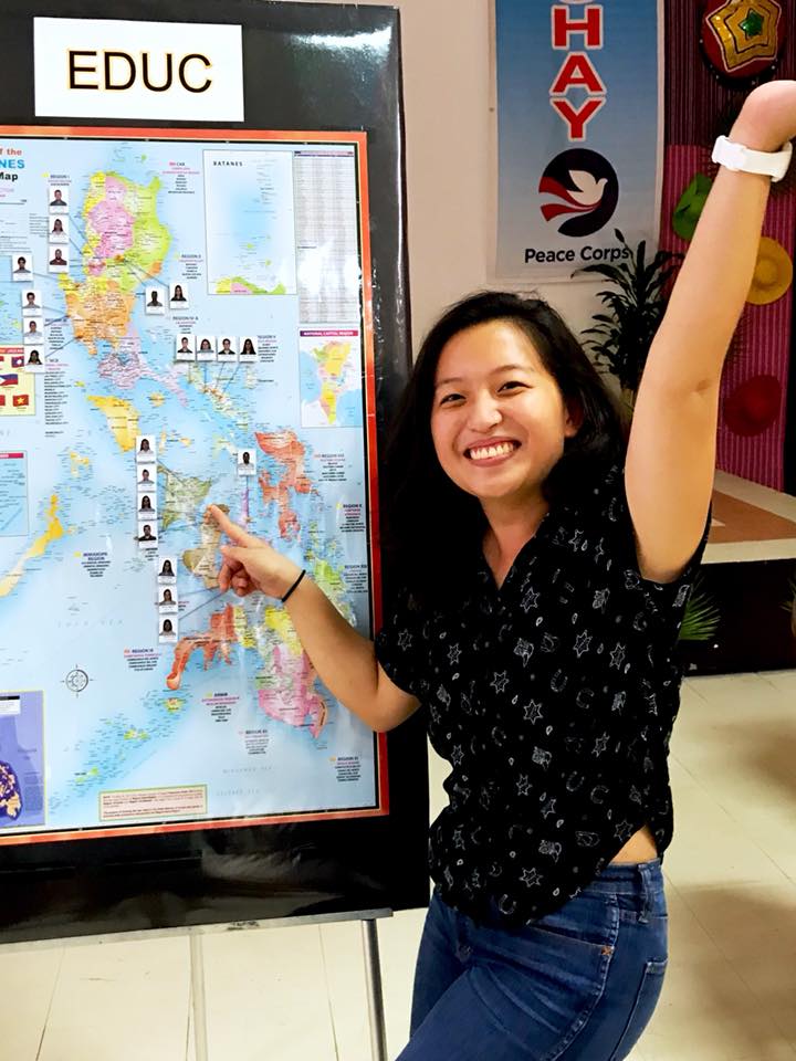  Stephanie Estrera pointing to the Philippines on a map