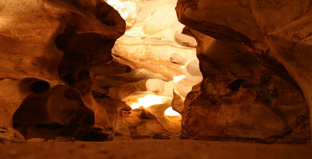 Inside of cave showing impressive rock formations.