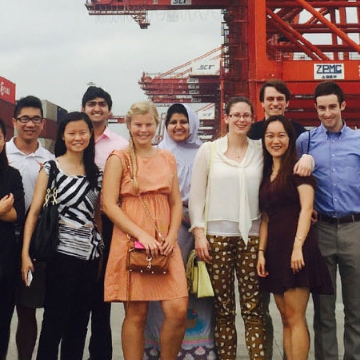 Group of interns posing for photo at port in Shenzhen, China