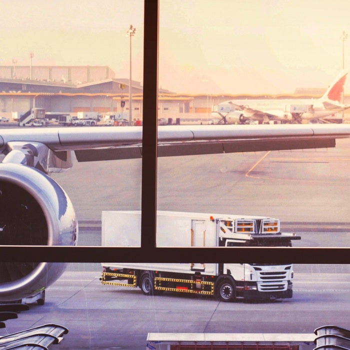 Modern airport terminal and airplane waiting in the gate