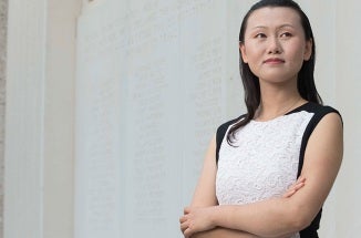 nanshu lu poses on campus