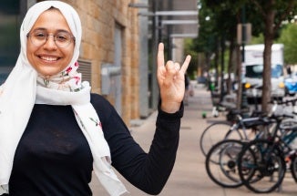 renad does a hook em in front of the texas global building