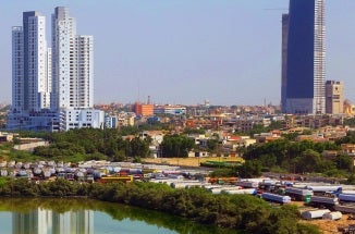 A view of buildings beside a river in Karachi, Pakistan