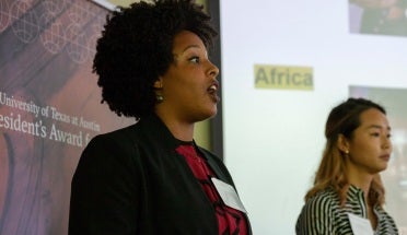 a presiden't award team member presents her team's project to the international board of advisors