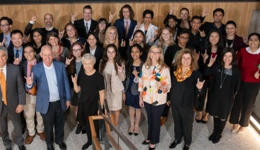 the winning teams of the president's award stand with Dr. sonia feigenbaum and president fenves