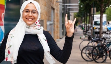 renad does a hook em in front of the texas global building