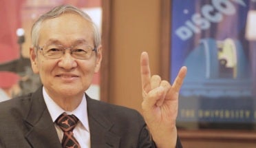 Sinichi Linura puts up hook'em horns hand sign