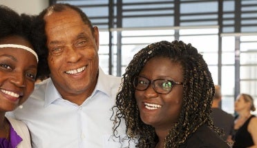 Academic director poses with fellowship recipients