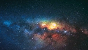 colourful galaxy in dark sky with stars