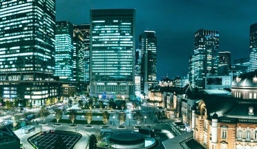 a view of buildings in tokyo at night