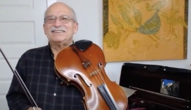 UT psychology professor Michael Domjan plays viola on YouTube