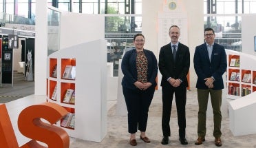 Representatives of UT Press stand proudly at their bookstand at FILUNI 2023