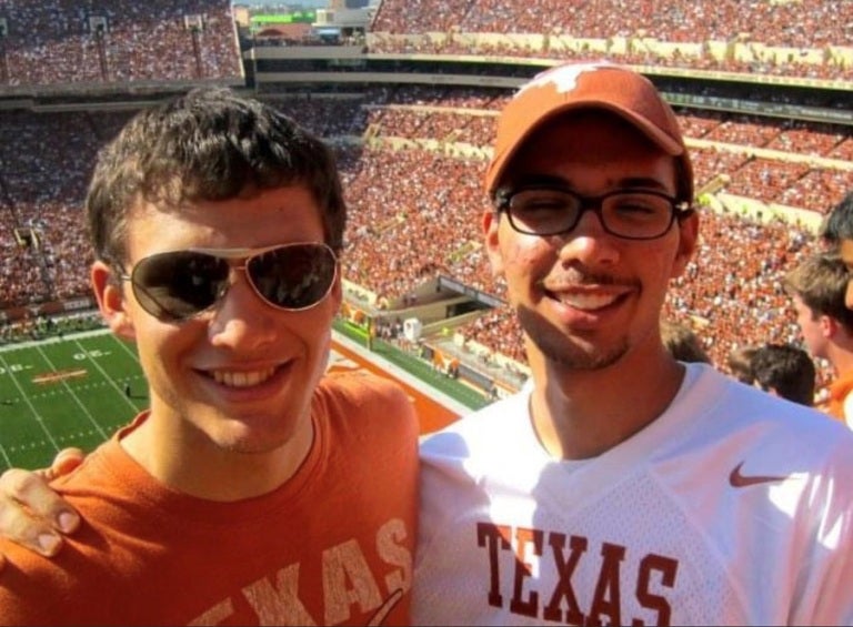 Omar Albarghouty and friend at a UT football game