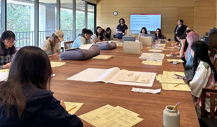 Global Summer Institute students work together in a classroom