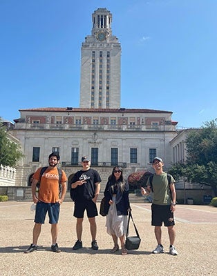 Adolfo and other students in front of UT tower